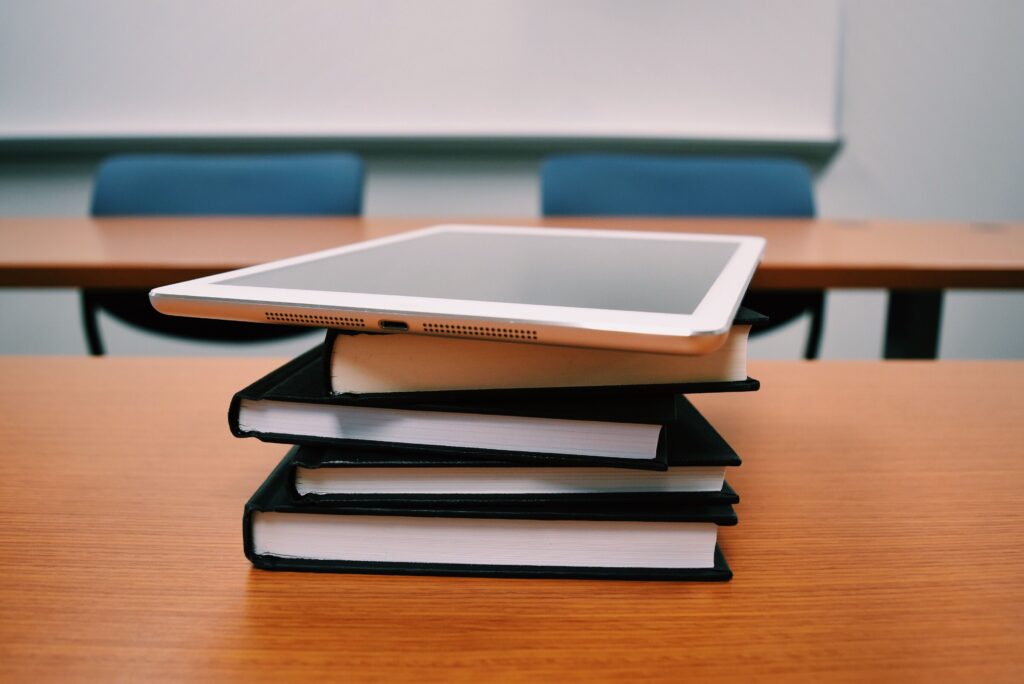 Text books and tablet on desk